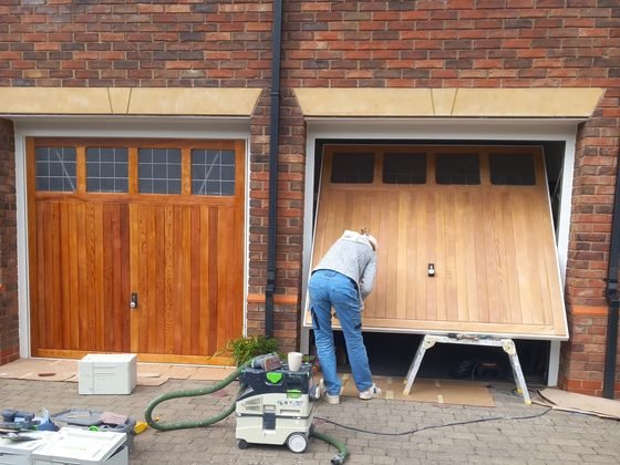 Sanding the second garage door on site