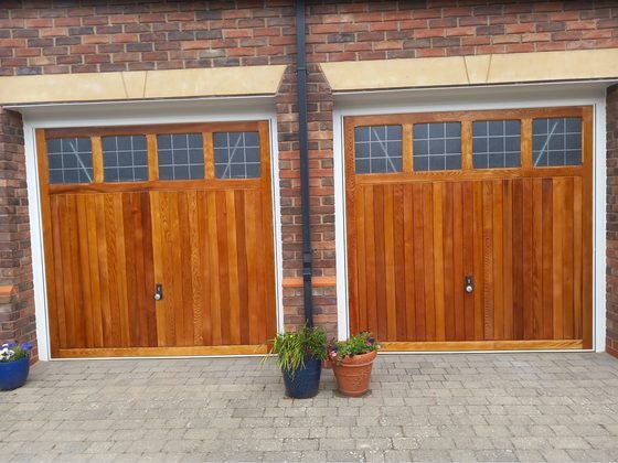 Both restored garage doors finished and stained