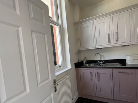 The finished hand-painted kitchen seen from the doorway